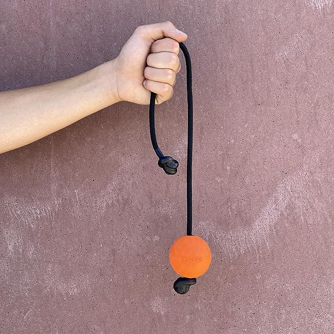 K9 Ops Dog Ball on a Rope Moki Tug Toy - Solid Rubber Fetch Training Reward - Large Dogs Durable Indestructible Chewers Pitbull Dobermann Rottweiler Shepherd (Tiger Orange - Black Rope)