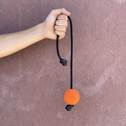 K9 Ops Dog Ball on a Rope Moki Tug Toy - Solid Rubber Fetch Training Reward - Large Dogs Durable Indestructible Chewers Pitbull Dobermann Rottweiler Shepherd (Tiger Orange - Black Rope)